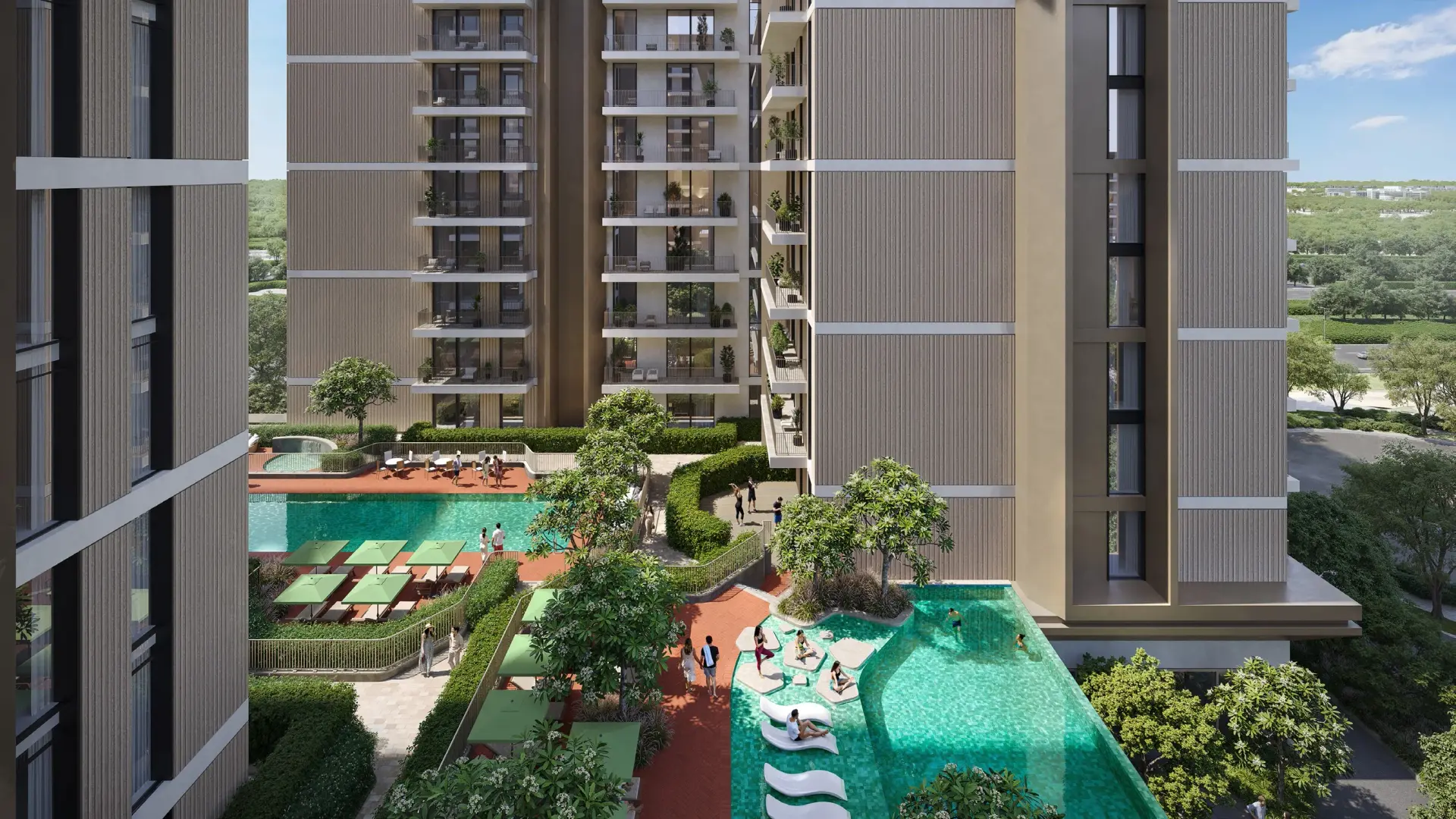 Main community swimming pool and deck at Expo Valley Views Ghadeer